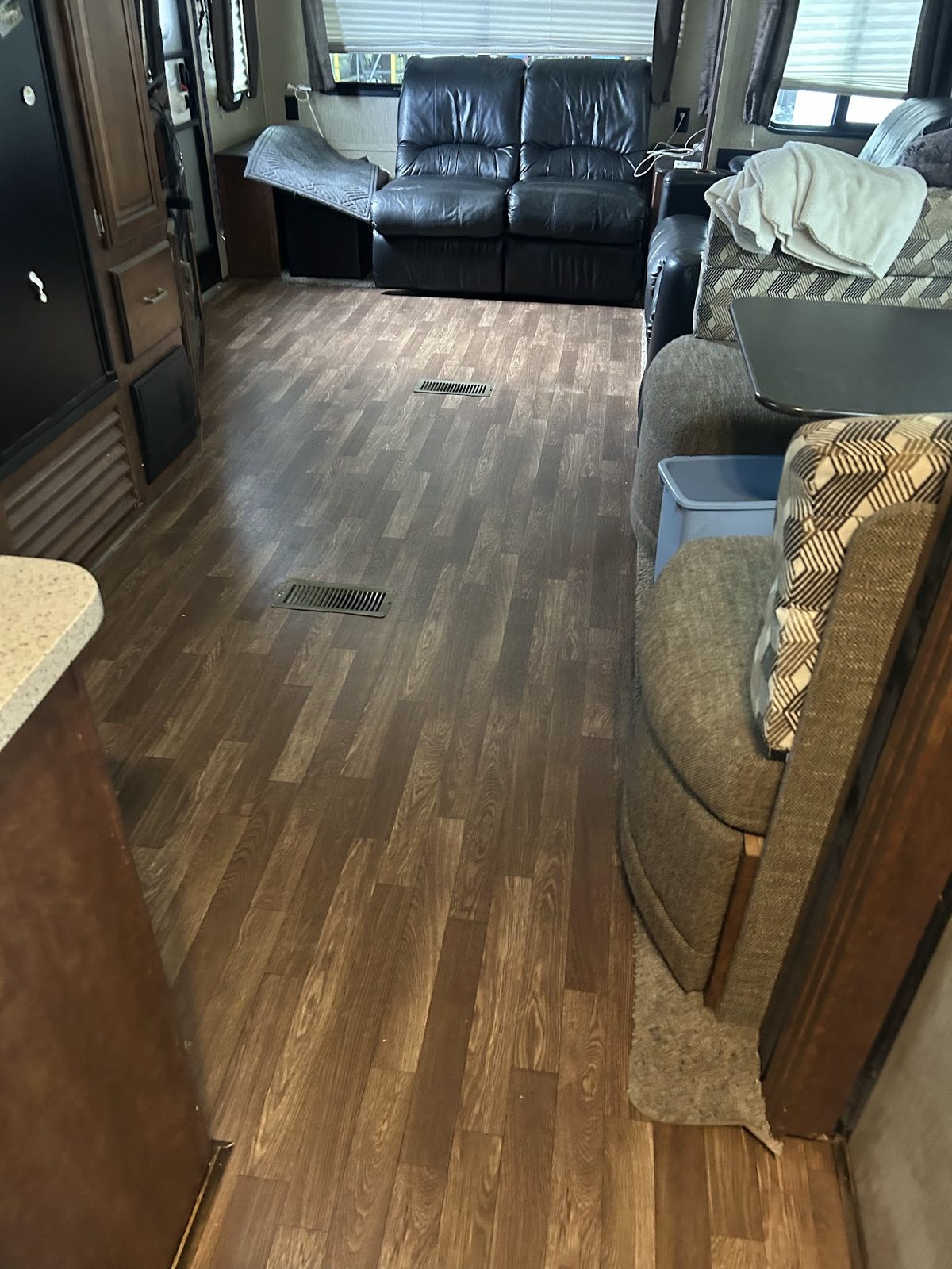 RV interior with new wood-look flooring after a renovation