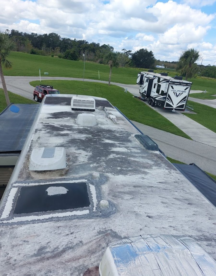RV roof with AC unit awaiting re-seal